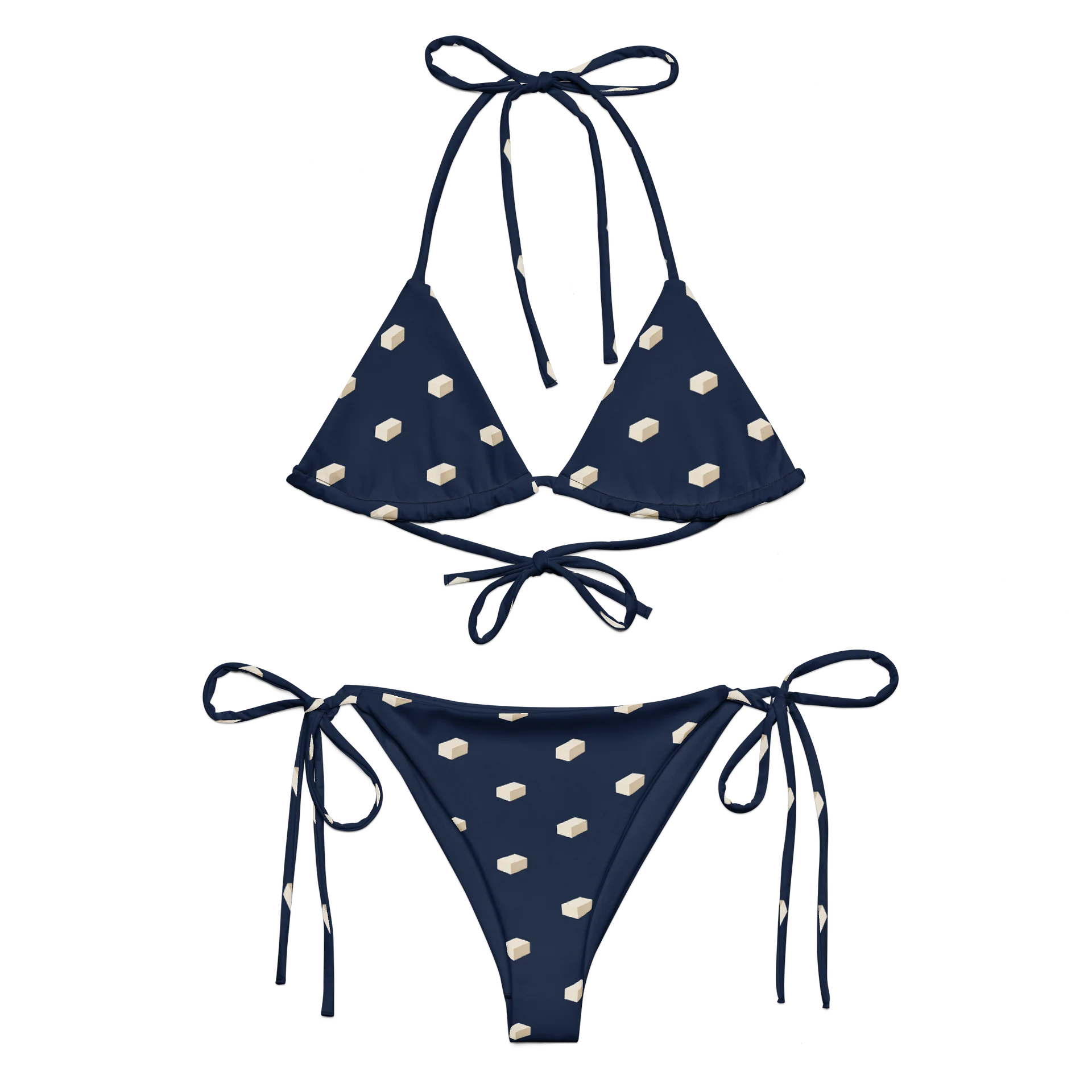 Navy string bikini with small ivory tofu-block prints, triangle top and matching tie-side bottoms