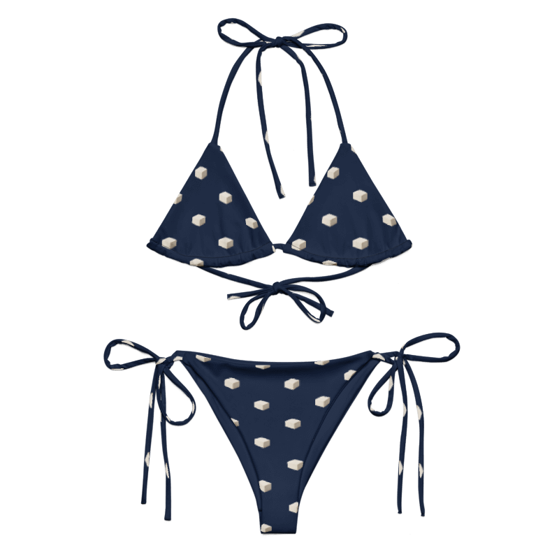 Navy string bikini with small ivory tofu-block prints, triangle top and matching tie-side bottoms